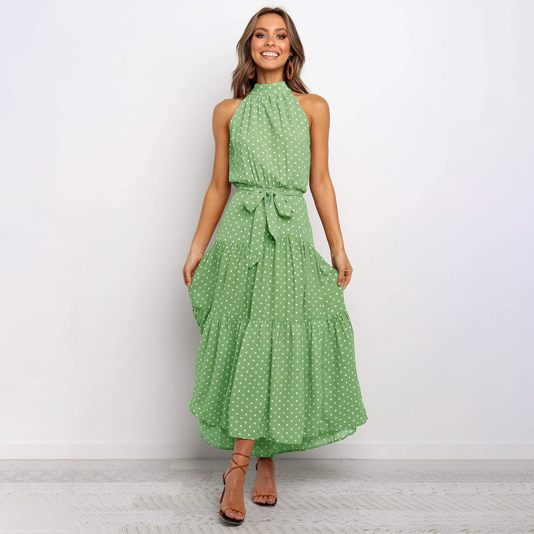Party-ready women's polka dot halter neck maxi dress, elegant for summer events.