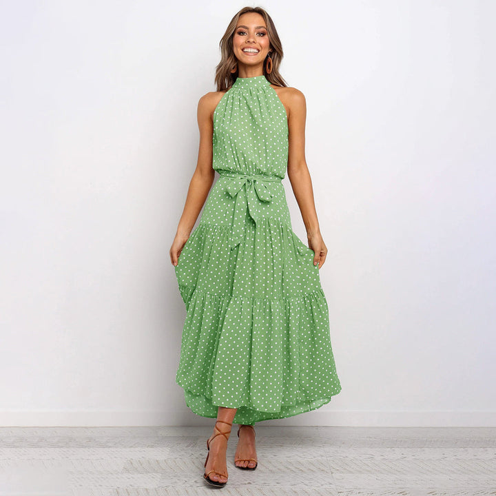 Party-ready women's polka dot halter neck maxi dress, elegant for summer events.
