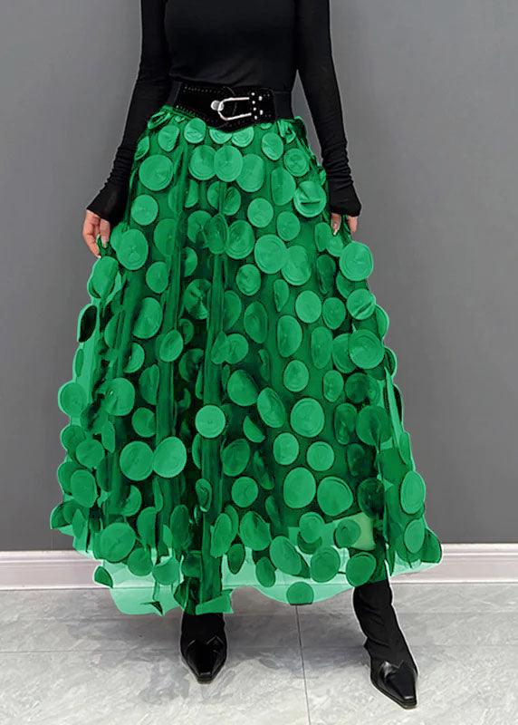 Elegant black polka dot tulle midi skirt for women. Trendy A-line design, versatile for occasions.