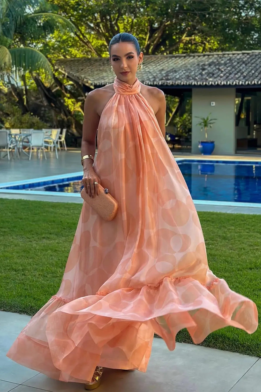 Elegant women's printed halter neck maxi dress, perfect for wedding guests & summer special occasions.