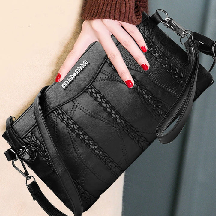 Versatile PU leather women's crossbody clutch; also worn as shoulder bag or elegant handbag.