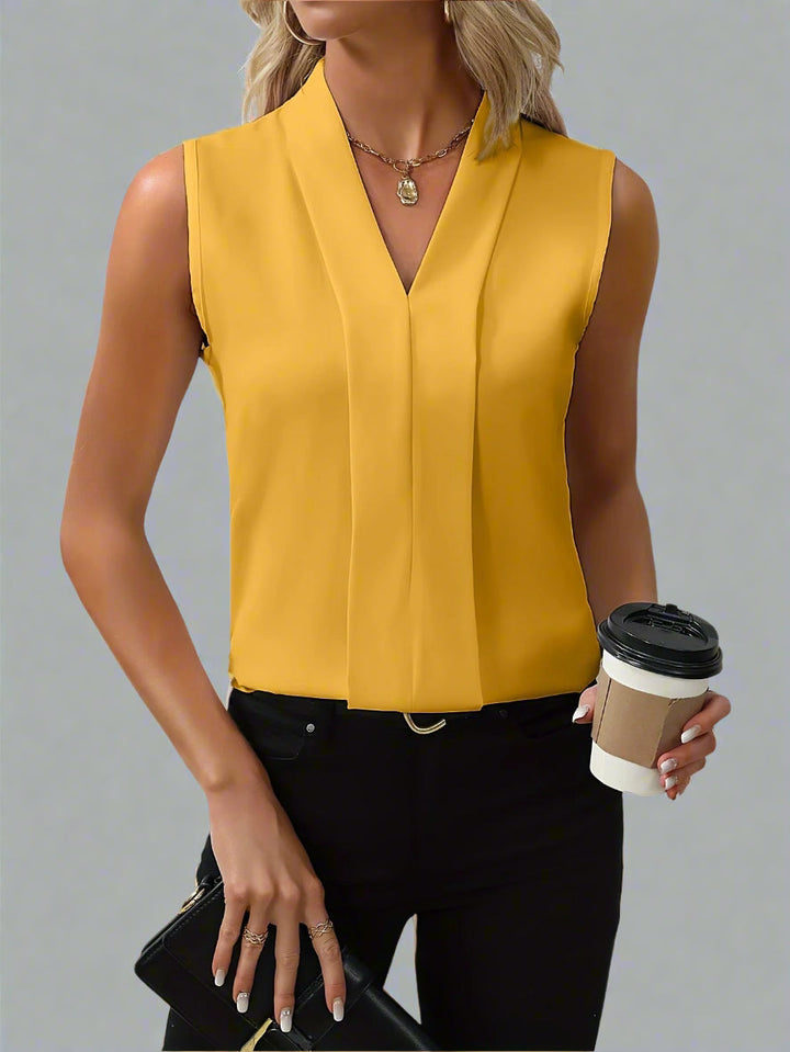 Stylish black Quinn sleeveless V-neck blouse for women, ideal for elegant business casual and office fashion.