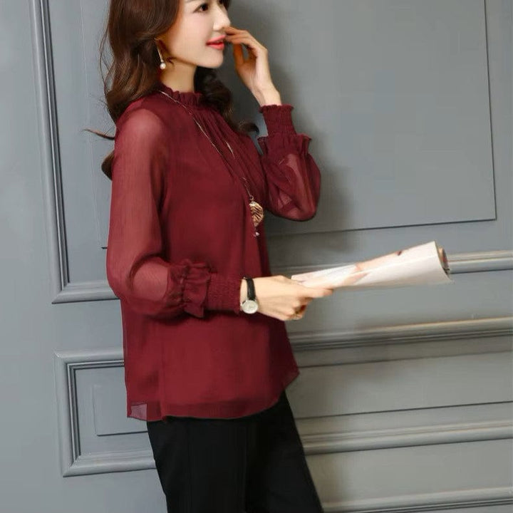 Chic women's chiffon ruffle blouse with transparent puff sleeves. An elegant top for versatile spring & summer fashion.