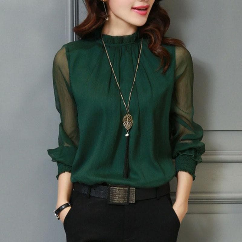 Feminine women's ruffle blouse with sheer puff sleeves, an elegant top for casual chic or sophisticated office style.