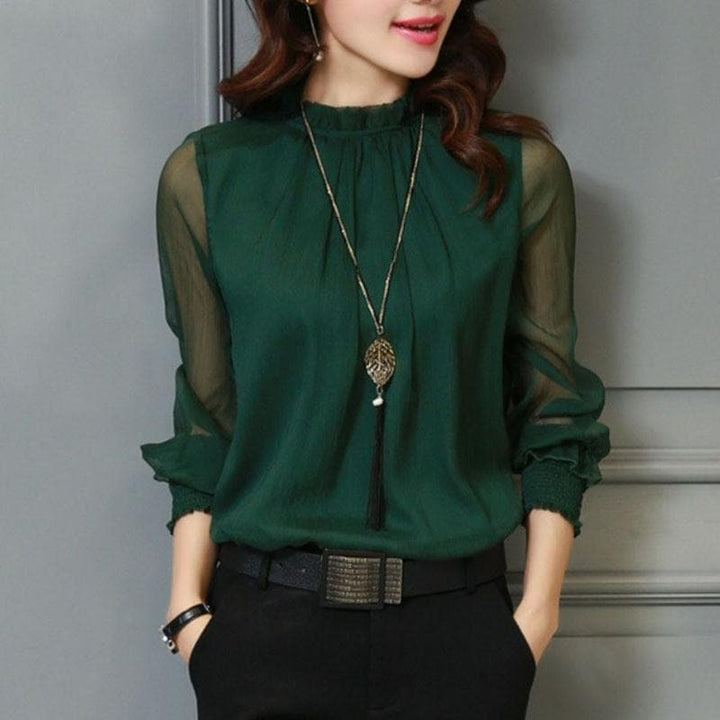 Feminine women's ruffle blouse with sheer puff sleeves, an elegant top for casual chic or sophisticated office style.
