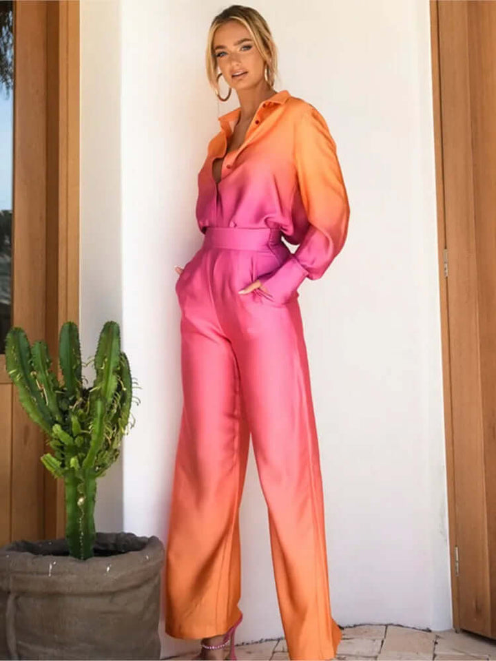 Elegant women's satin-feel wide-leg jumpsuit with long sleeves & button-down front, perfect for evening or daywear.