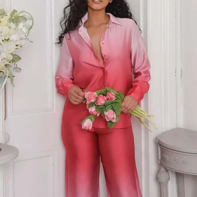 Stylish women's wide-leg jumpsuit in satin-feel fabric, long sleeve, button-down design for elegant, comfortable fashion.