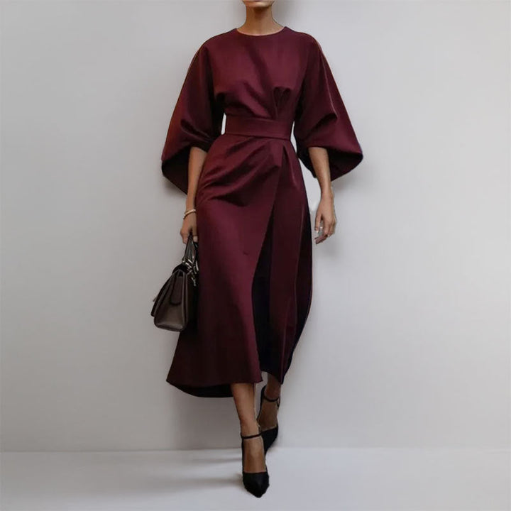 Women's long satin dress featuring stylish batwing sleeves & a beautiful draped silhouette, perfect for formal occasions.