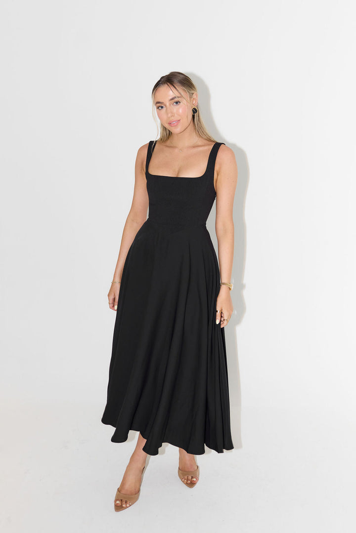 Stunning women's satin midi length dress, elegant and smooth, featuring a flattering square neckline.