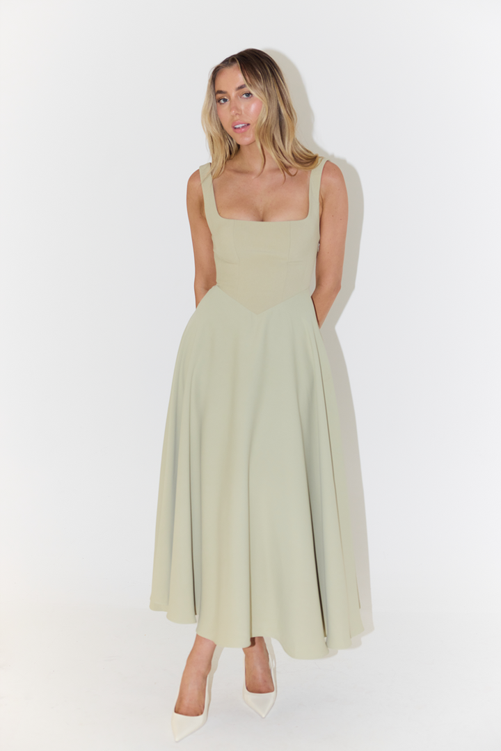 Versatile women's sleeveless midi dress in luxurious satin, a stylish choice for cocktail or evening wear.