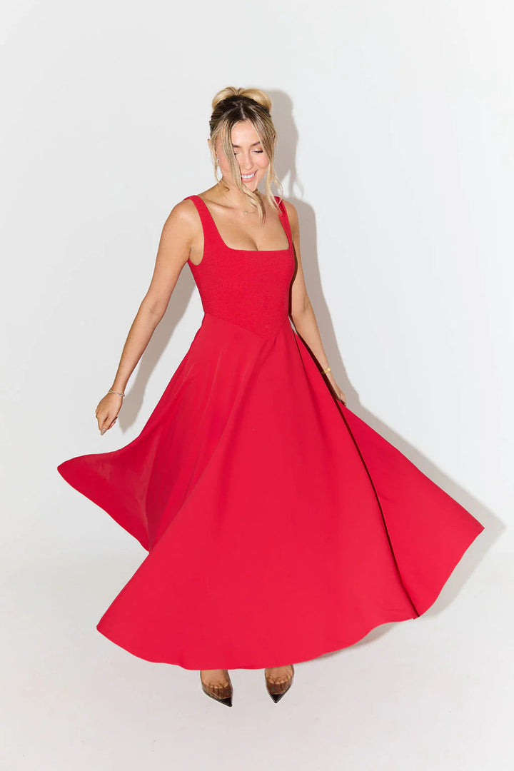 Timeless women's satin midi dress, smooth & elegant, featuring a square neck and sleeveless silhouette.