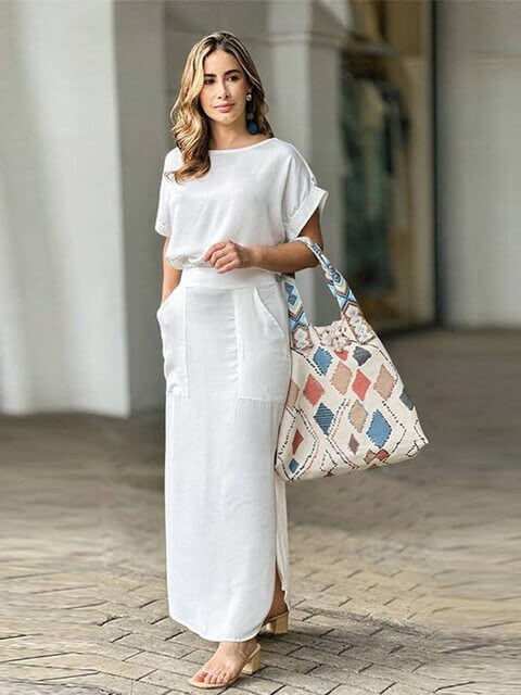 Stylish women's satin two-piece outfit with a trendy crop top and elegant high-waist maxi skirt.