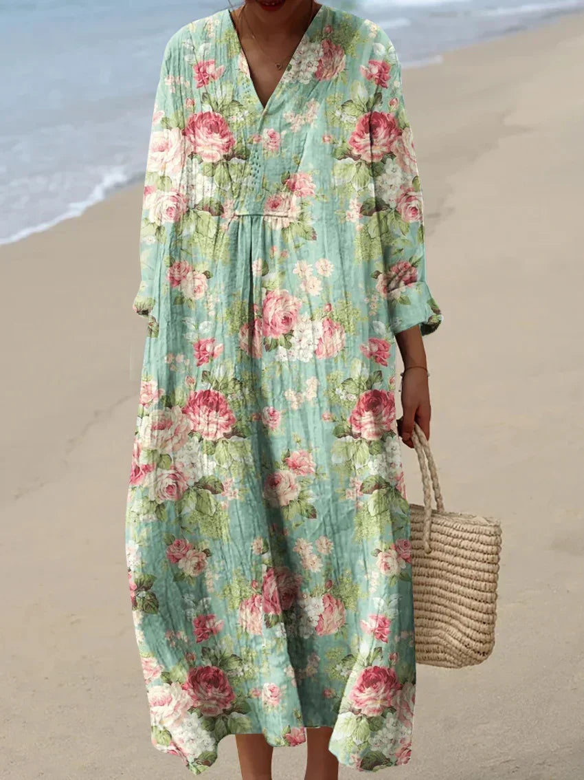 Elegant women's sky blue floral midi dress with a beautiful rose print, perfect for summer parties.