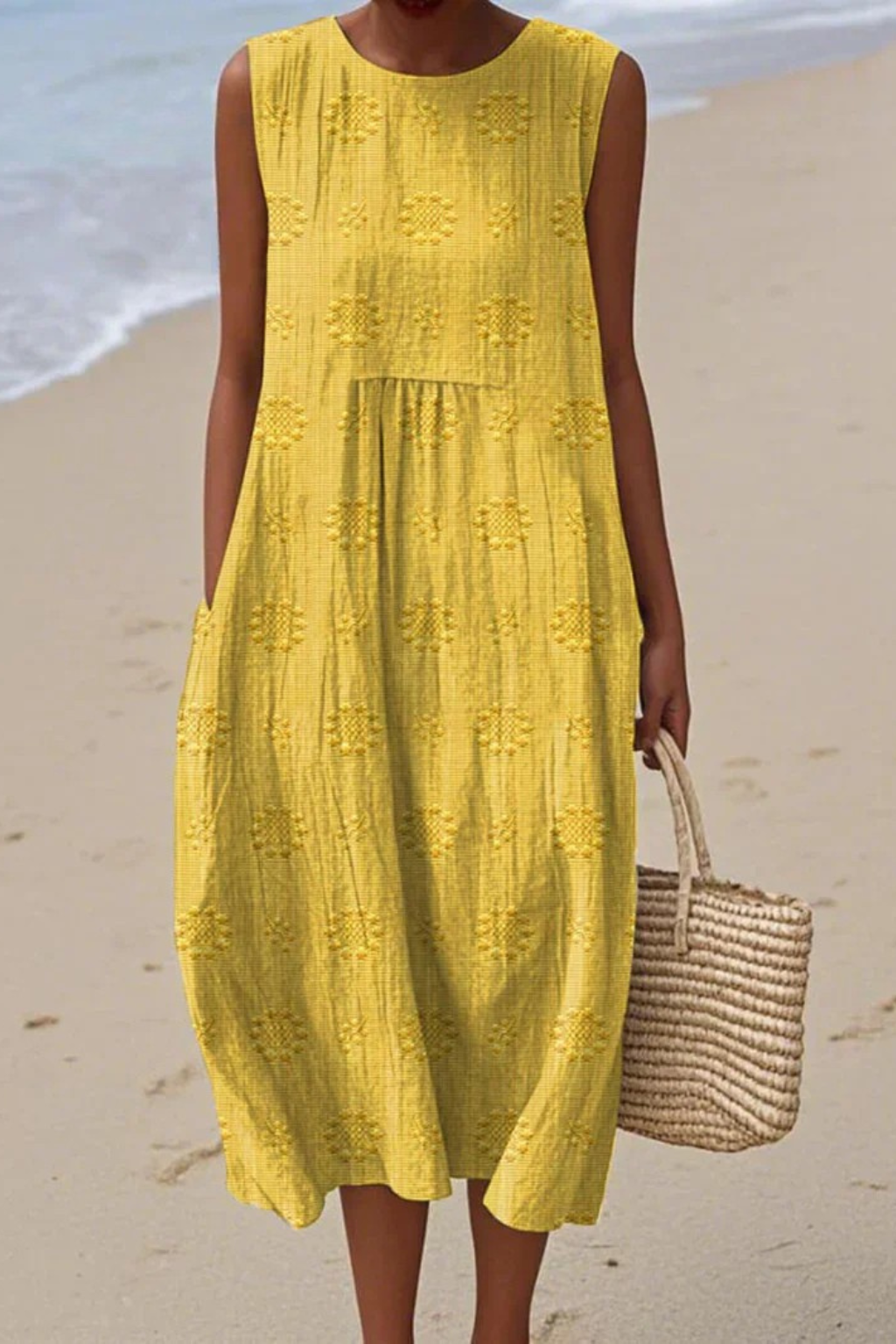 Full shot of women's sleeveless embroidered dress, perfect for a chic summer event or elegant vacation.