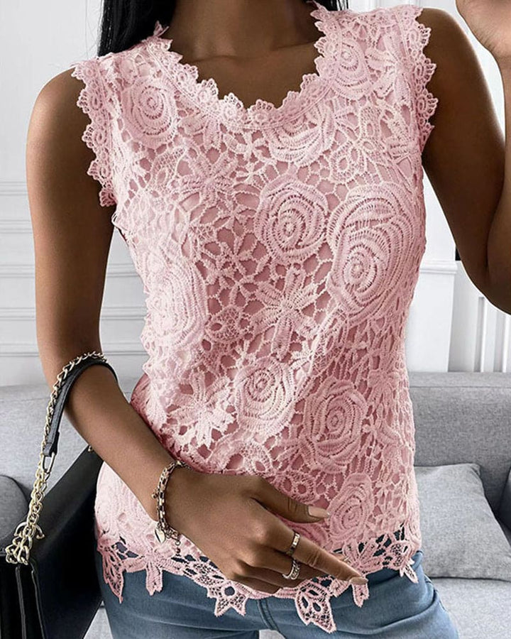 Lightweight women's sleeveless blouse with round neck, solid color & elegant lace patchwork. Ideal for summer fashion.