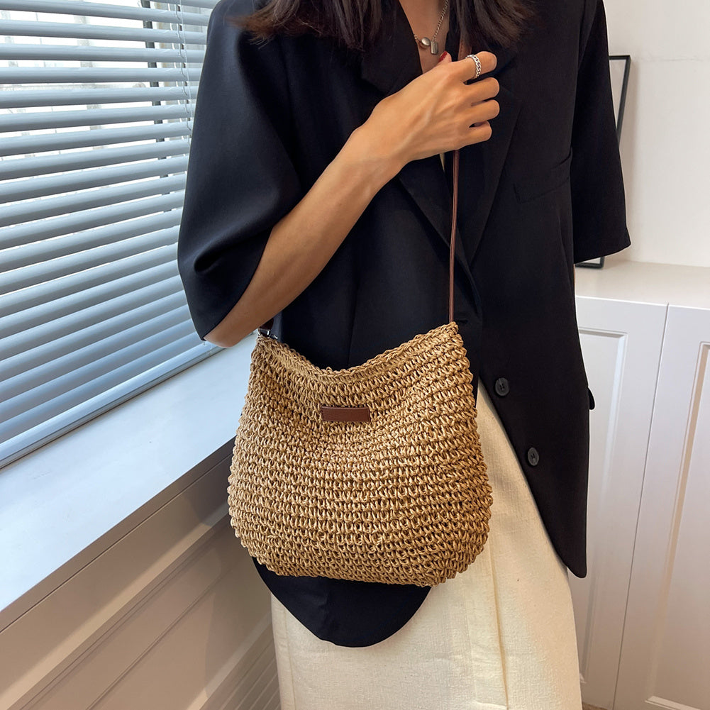 Stylish beige/brown women's shoulder bag with relaxed elegance. Soft material handbag, perfect for any outfit.