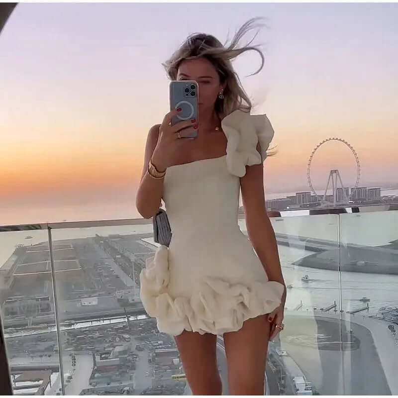 Stylish women's elegant strapless mini dress with ruffles, ideal for summer parties & special events.
