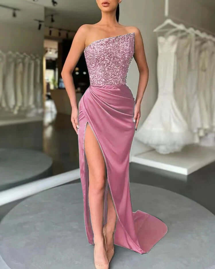 Stunning women's high slit evening dress with a sequined strapless bodice. Perfect for prom, party, or gala events.