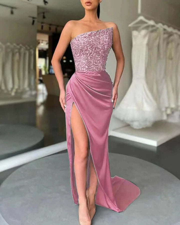 Stunning women's high slit evening dress with a sequined strapless bodice. Perfect for prom, party, or gala events.