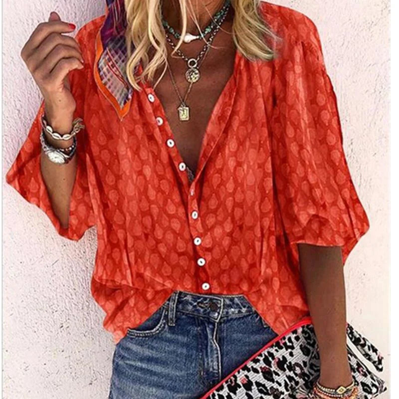 Colorful women's elegant blouse with airy, relaxed fit. Comfortable short sleeve summer top for versatile fashion.