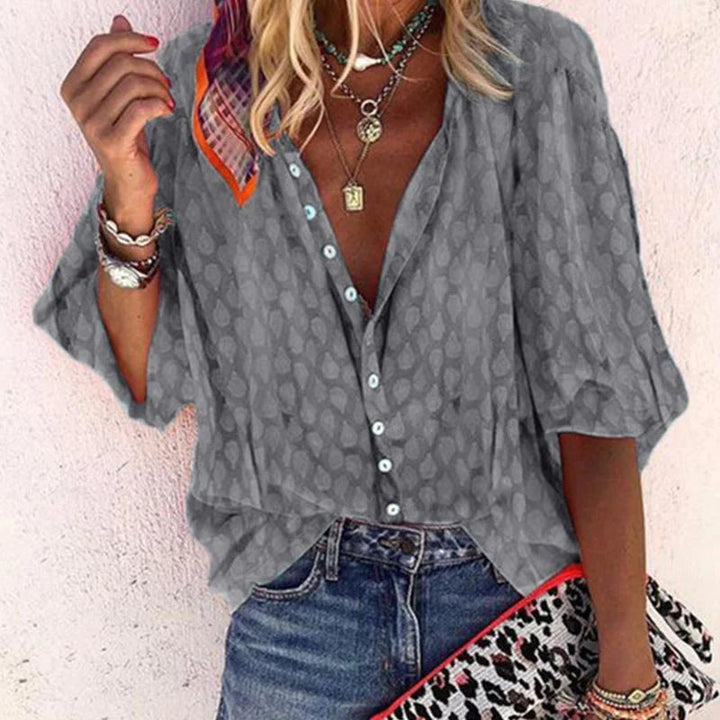 Women's comfortable summer blouse, airy and elegant. Short sleeve top with relaxed fit for spring outfits and everyday style.