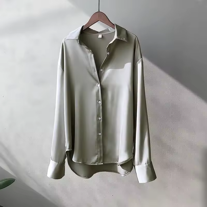 Stylish women's summer blouse, a comfortable and versatile top for elegant casual or office wear.