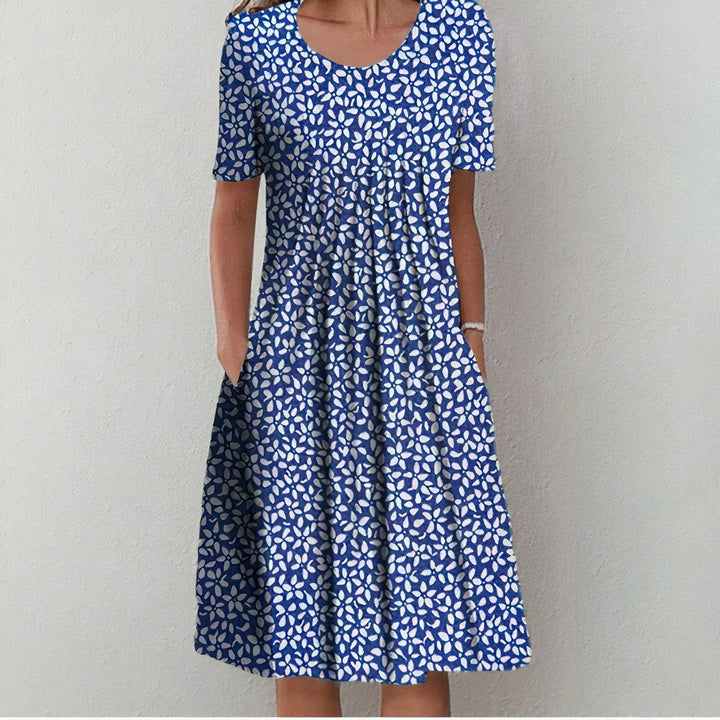 Comfortable polka dot women's summer midi dress, versatile & elegant for casual day or holiday outfits.