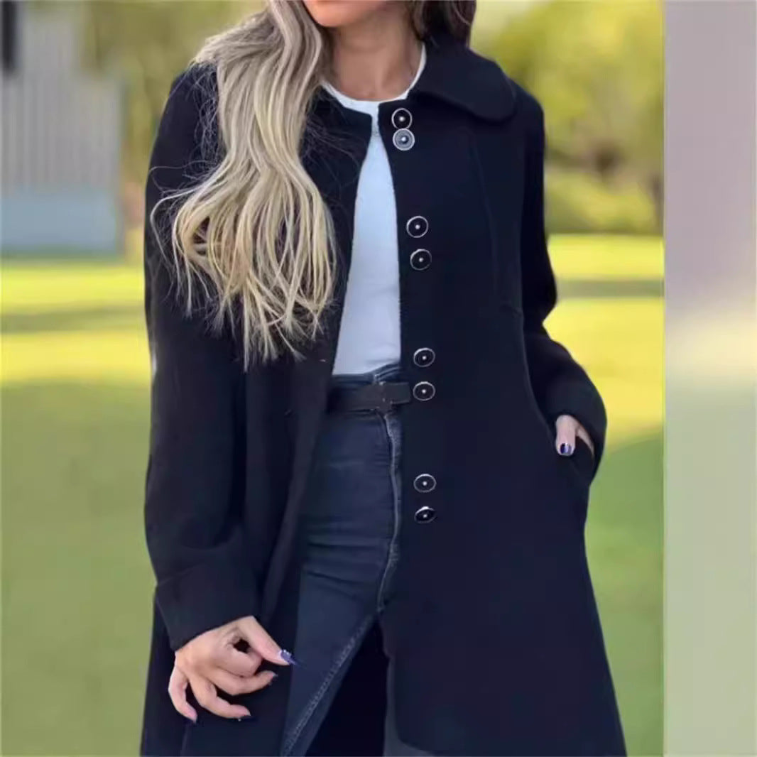 Stylish black structured tailored coat, thigh-length for women. Perfect elegant outerwear for professional winter outfits.