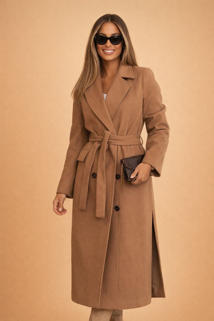 Classic women's belted long overcoat in rich caramel. Tailored fit for elegant winter fashion & city wear.