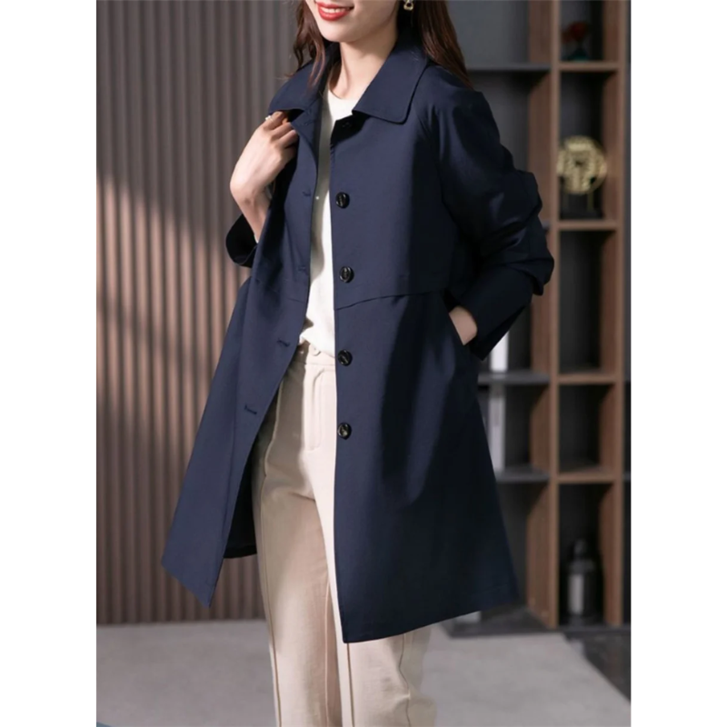 Stylish women's tailored polyester trench coat. Mid-thigh length, versatile for casual or business fashion.