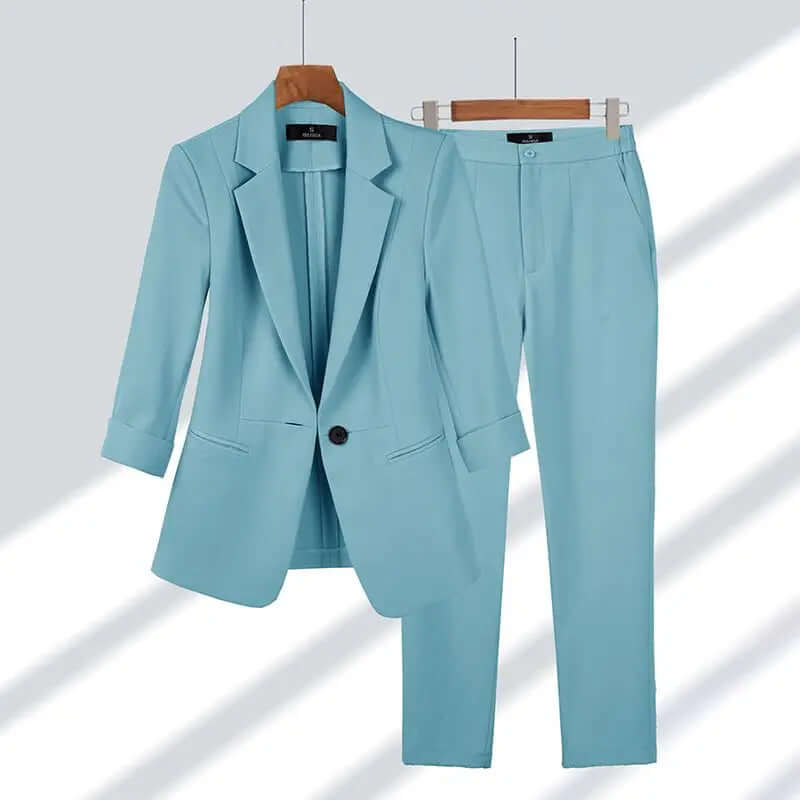 Professional woman confidently walking in a sophisticated tailored suit set, perfect for business meetings & formal events.