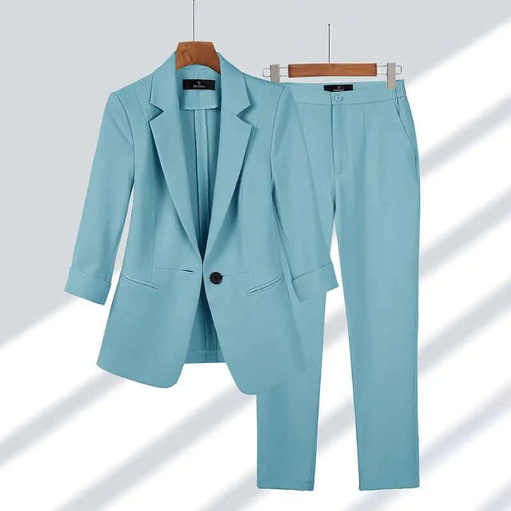 Professional woman confidently walking in a sophisticated tailored suit set, perfect for business meetings & formal events.