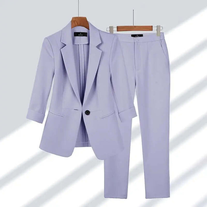 Back view of a women's elegant tailored suit set, showcasing a flattering fit and precise tailoring for formal business attire.
