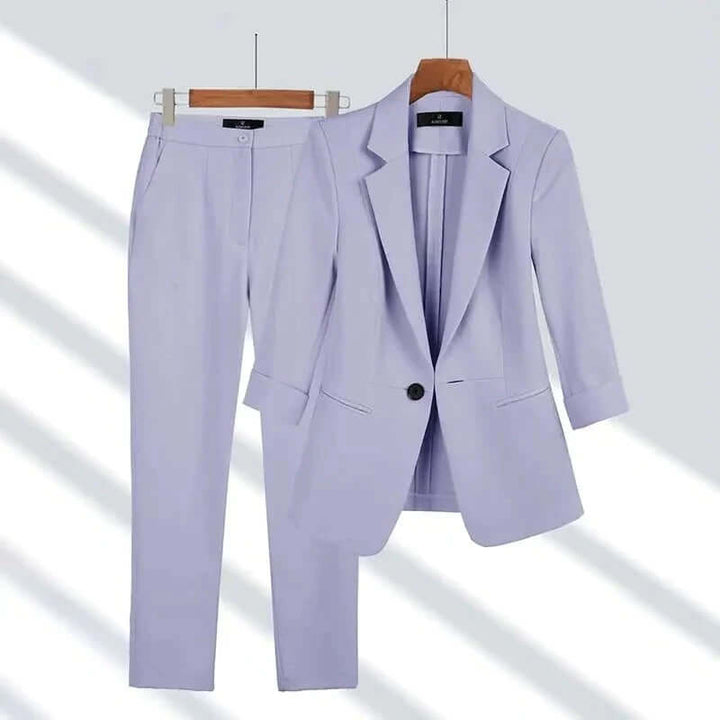 Stylish two-piece women's tailored suit set, versatile for business attire or elegant formal wear with blazer and pants.