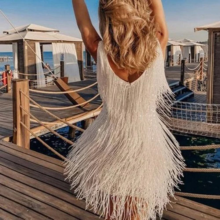 Sophisticated women's mini dress with playful tassels. Ideal elegant party & occasion wear.