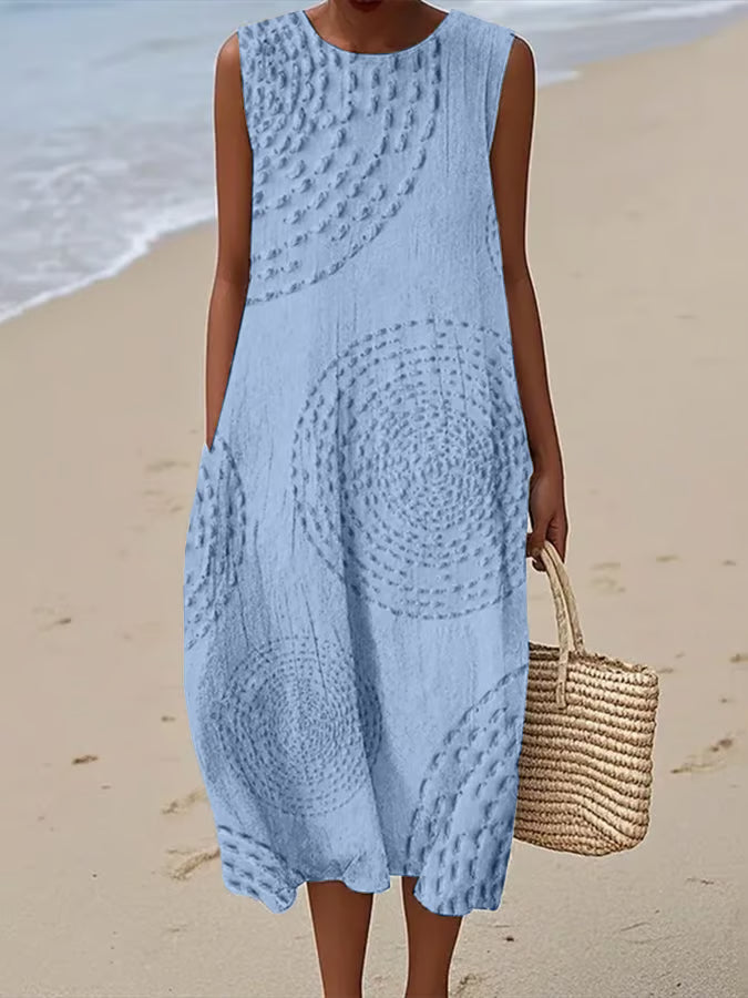 Women's elegant textured sleeveless maxi dress, comfortable and flowing for summer evenings.