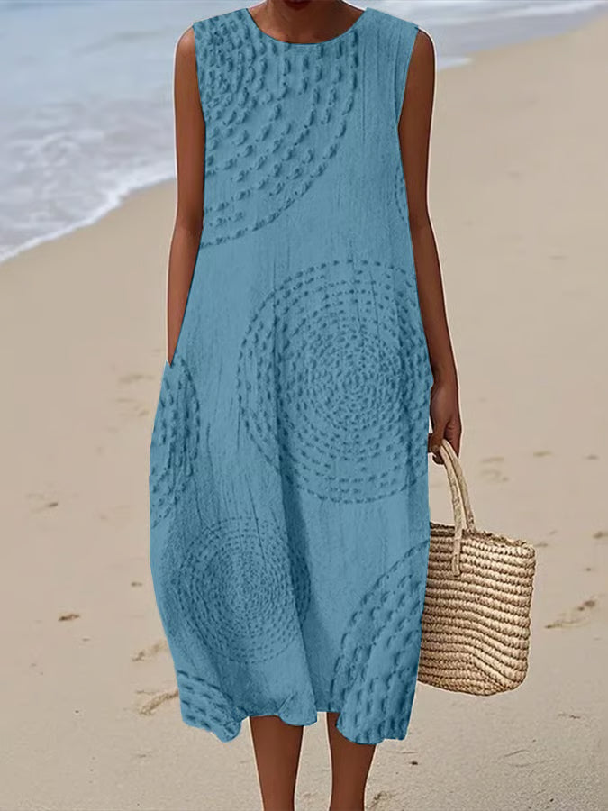 Versatile women's textured sleeveless maxi dress, great for casual summer or elegant evening wear.