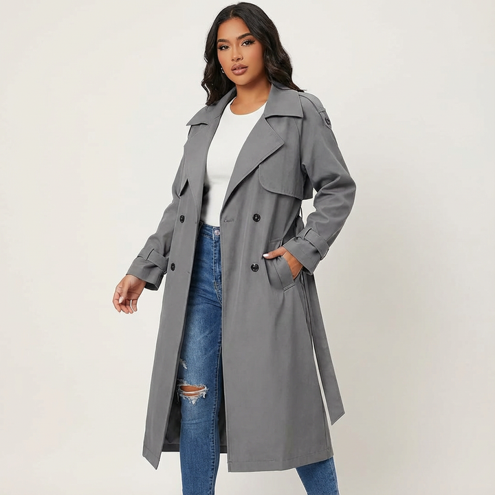 Stylish women's long trench coat, classic double-breasted design. Elegant outerwear for a sophisticated look.