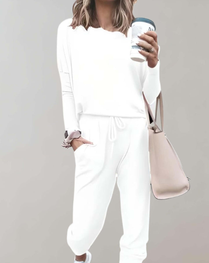 Textured tweed women's two-piece set. Elegant skirt suit for a sophisticated, chic autumn look.