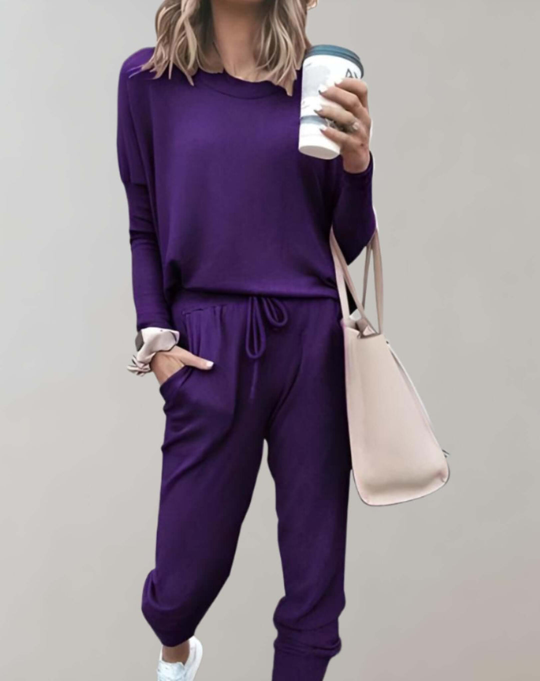 Tailored women's tweed jacket & matching skirt set. Versatile two-piece for sophisticated looks.