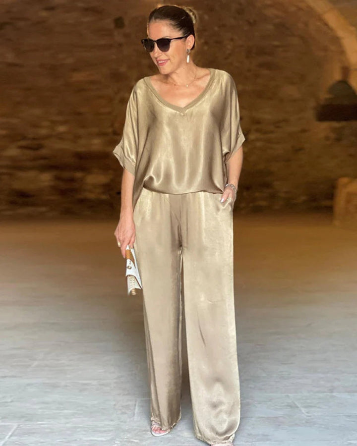 Modern women's green two-piece pants set, versatile & comfortable for spring fashion & sophisticated style.