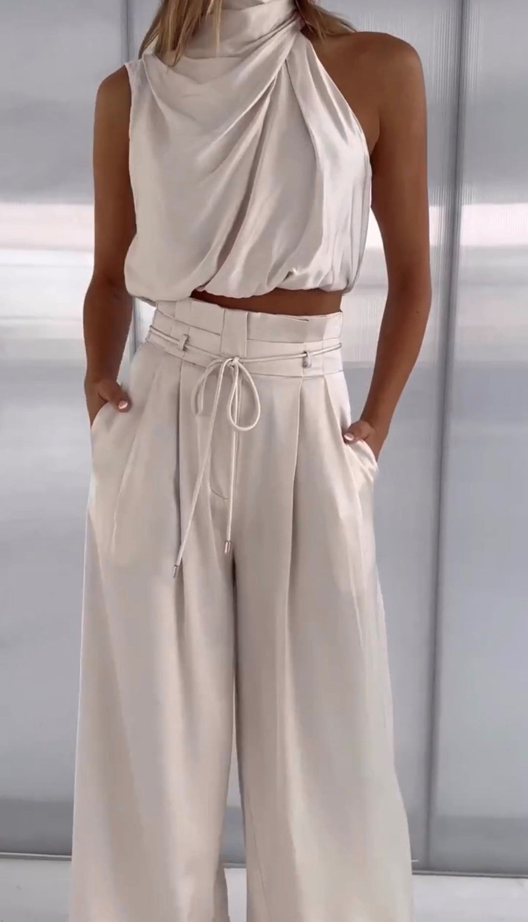 Elegant women's two-piece linen blend outfit, perfect for summer. Chic matching set.