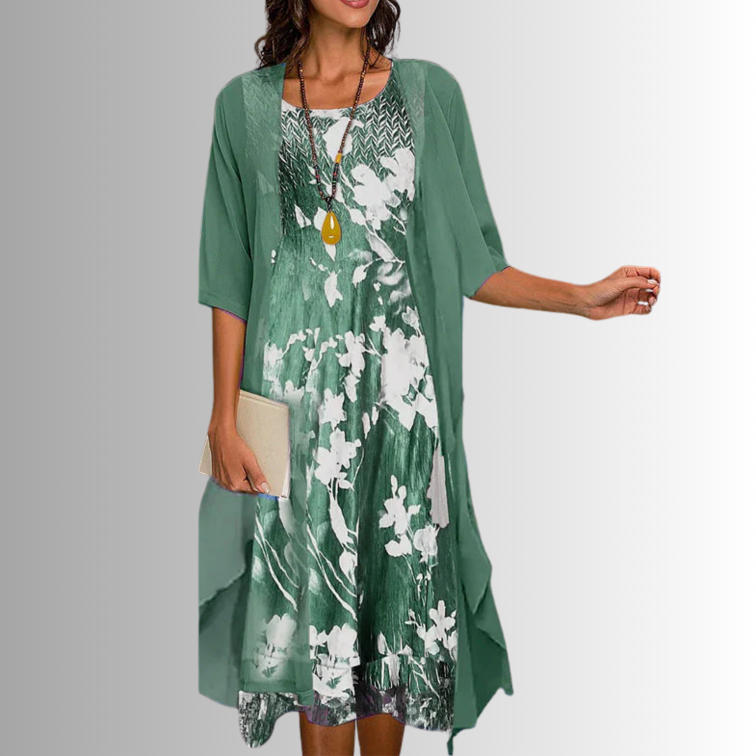 Elegant women's two-piece outfit with a flowing top and matching pants, perfect for sophisticated summer style.