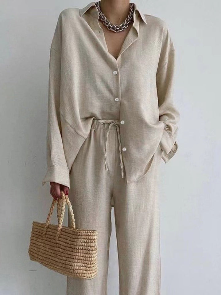 Elegant women's two-piece summer set: chic blouse & wide-leg pants. Perfect for casual resort wear.