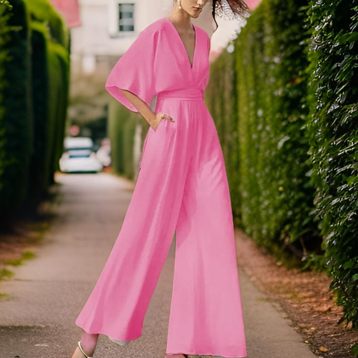 Women's Aurora Chic V-neck jumpsuit with three-quarter sleeves, a comfortable & elegant summer outfit for any occasion.