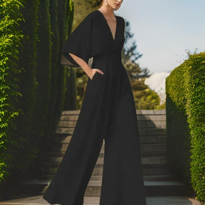 Fashionable women's V-neck jumpsuit with 3/4 sleeves, offering comfortable style for elegant summer and party wear.