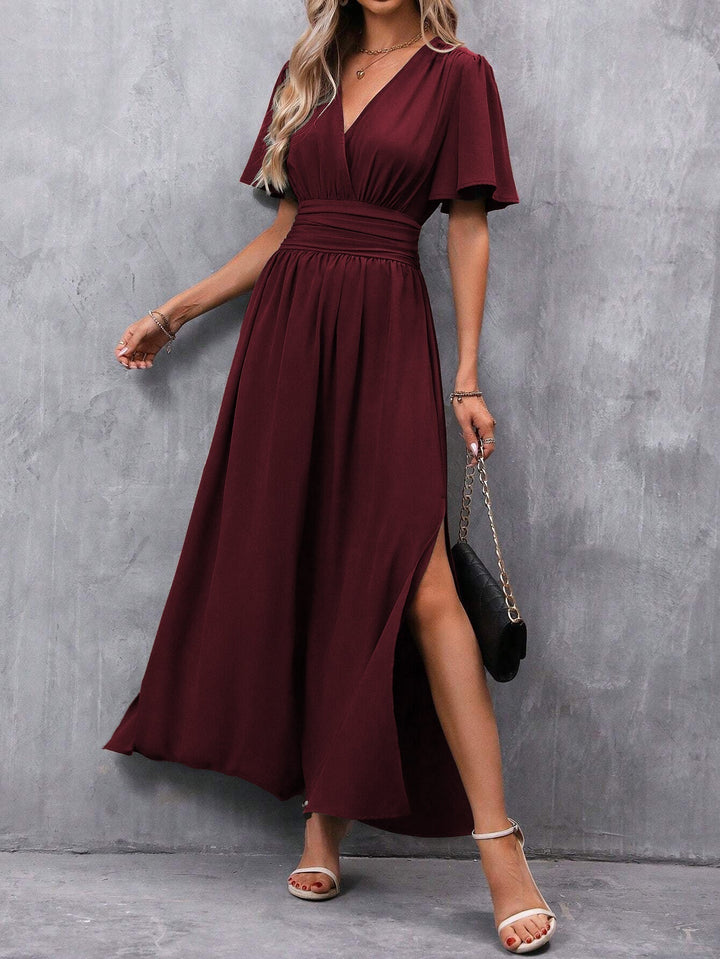 Stylish V-neck empire waist maxi dress for women, flowy A-line summer fashion, suitable for casual or party.
