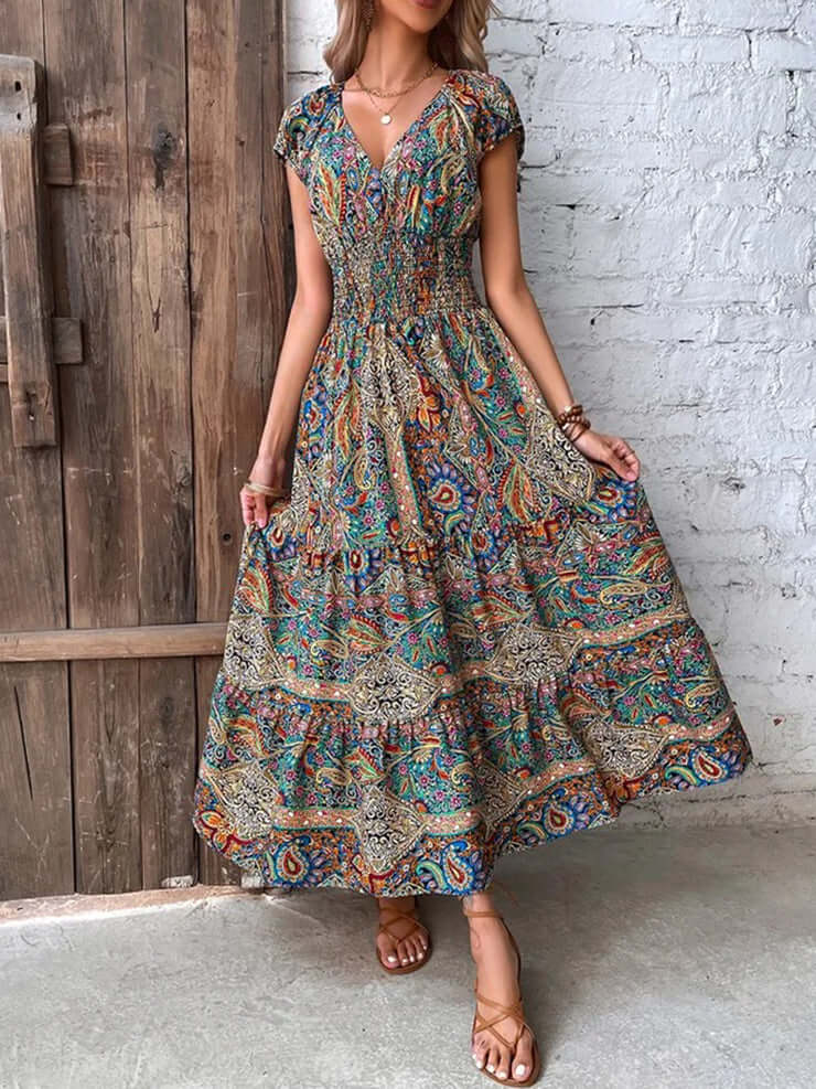 Sleeveless elegant V-neck midi dress for women, ideal as a summer or vacation dress. Effortless style.