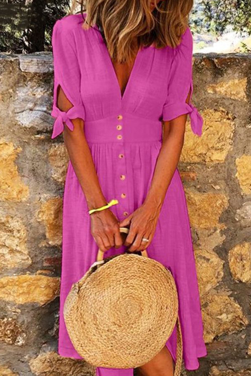 Loose-fit women's midi dress featuring a stylish V-neck, short sleeves & tie-cuff detail. Great for summer.