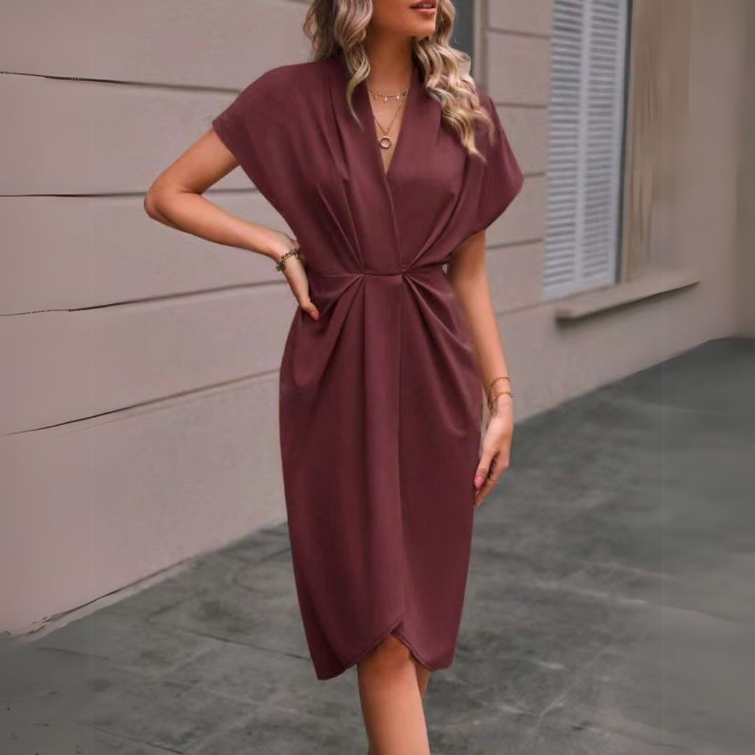 Chic women's V-neck midi dress with dolman sleeves, ideal for versatile professional and smart casual office wear.